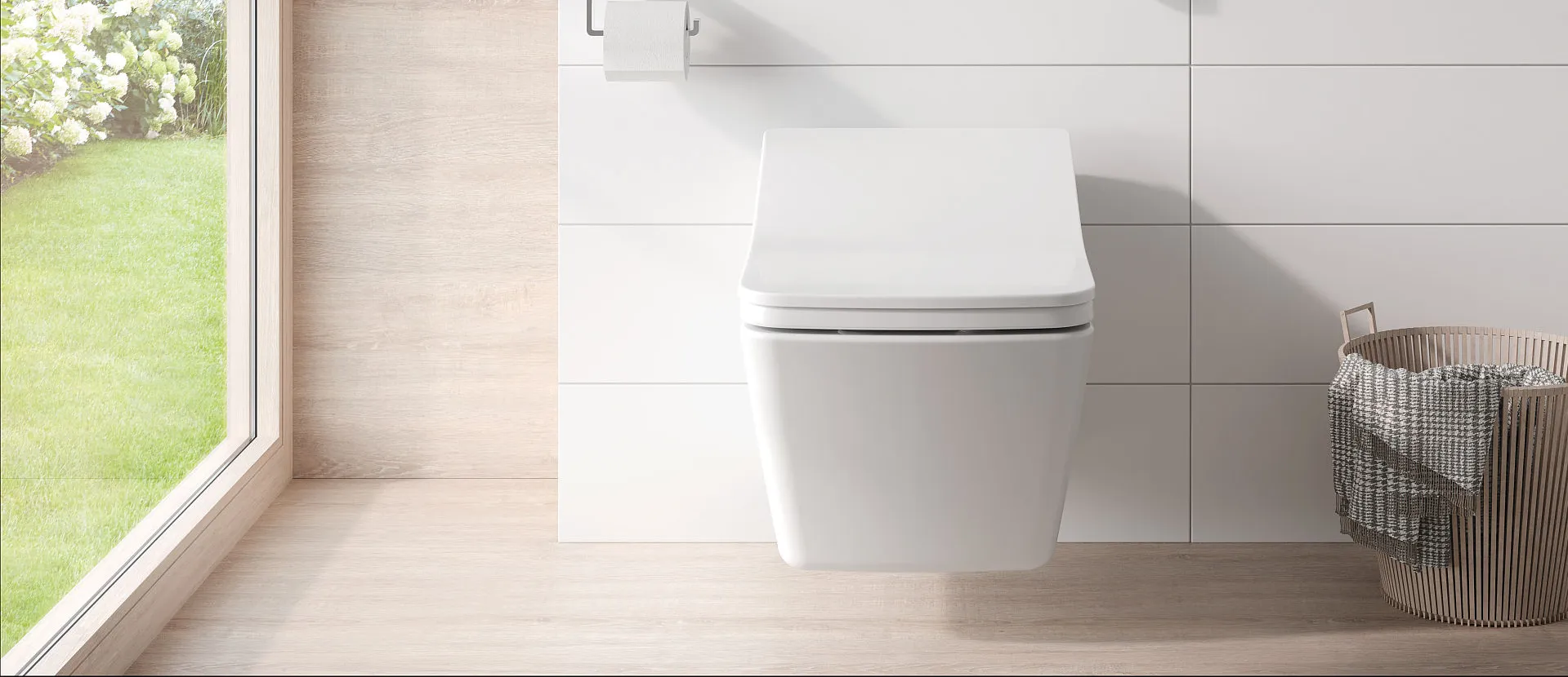 Ein wandhängendes, vor weißen Fliesen montiertes Toto WASHLET SX mit kompakter, abgerundeter Form und leicht geneigtem Deckel. 