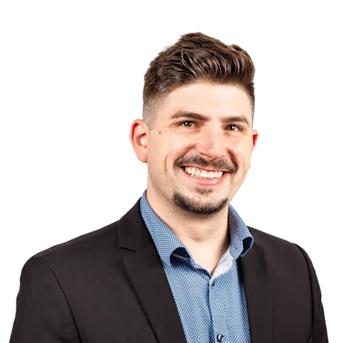 Portrait von Andreas Zimmermann vor neutralem Hintergrund.